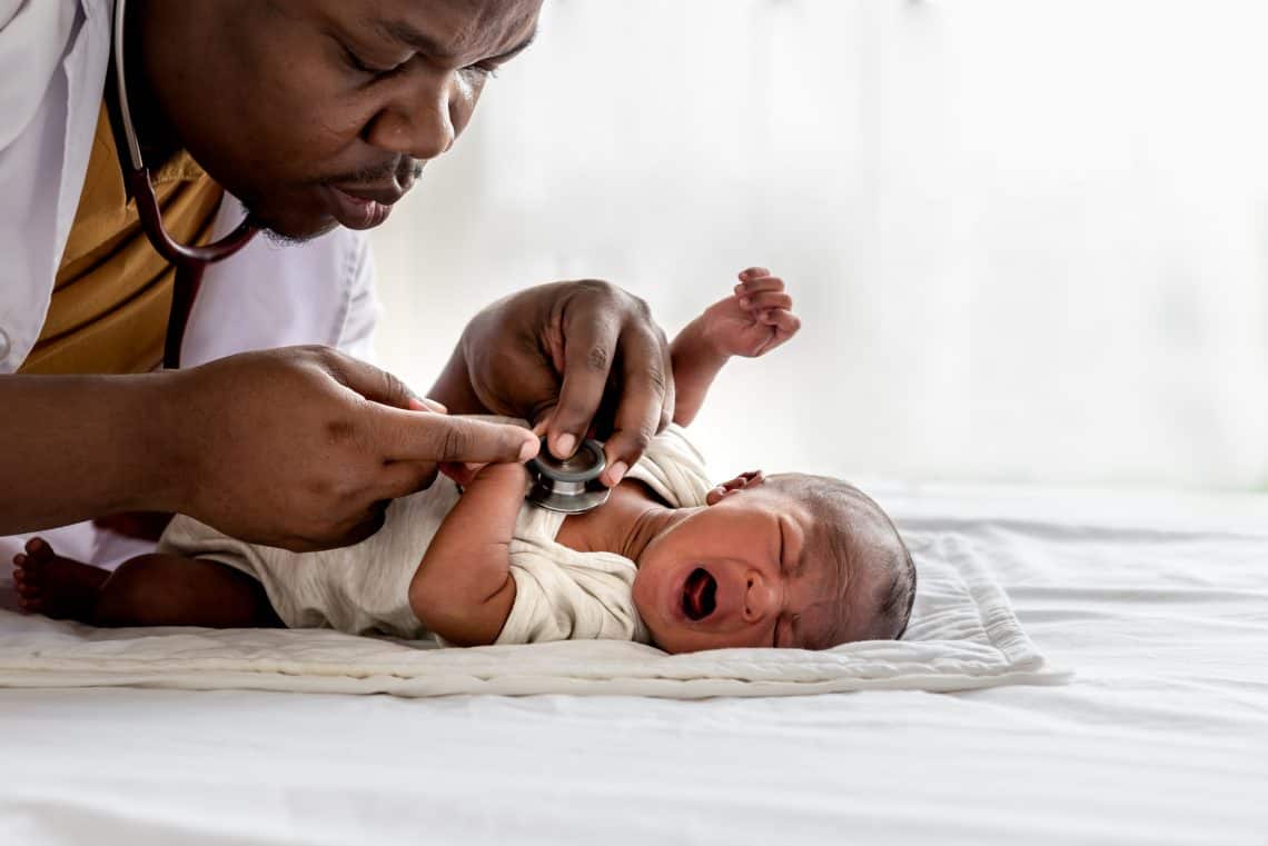African doctor using a stethoscope, checking the respiratory system, heartbeat Of a 12-day-old baby